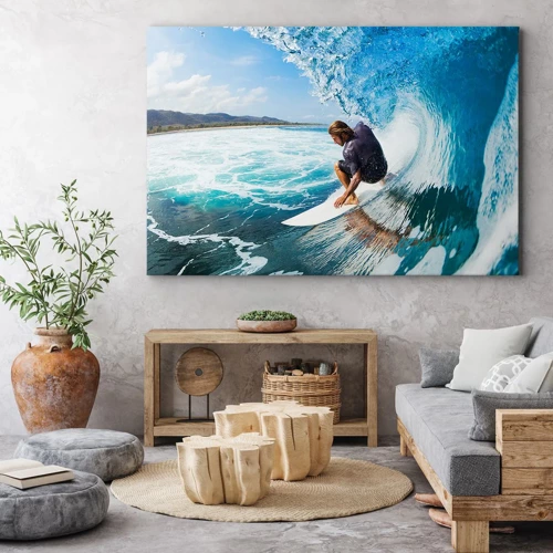 Obraz na płótnie - Tańczący z falami - Surfer w dynamicznej pozie na fali w turkusowej wodzie - 70x50cm