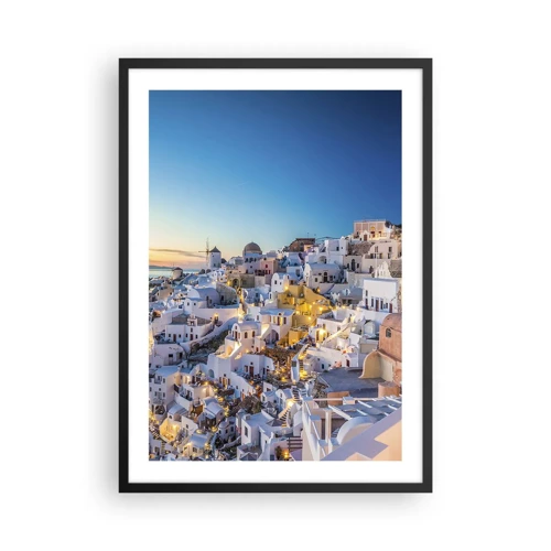 Plakat w czarnej ramie - Esencja greckości - Widok na oświetlone domy na Santorini o zachodzie słońca - 50x70cm