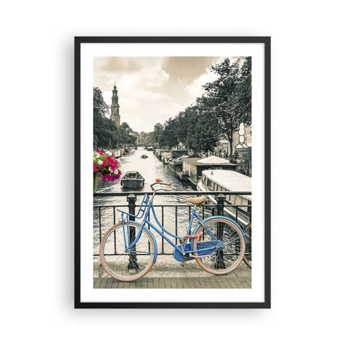 Plakat w czarnej ramie - Kolory amsterdamskiej ulicy - Niebieski rower na tle kanału w Amsterdamie - 50x70cm