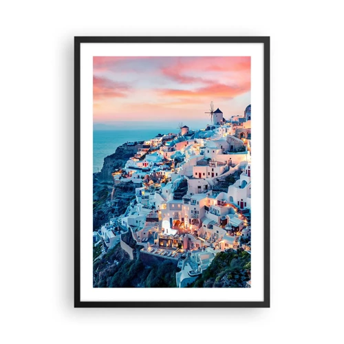 Plakat w czarnej ramie - Twoje wielkie greckie wakacje - Malowniczy widok na oświetlone domy na Santorini o zachodzie słońca - 50x70cm